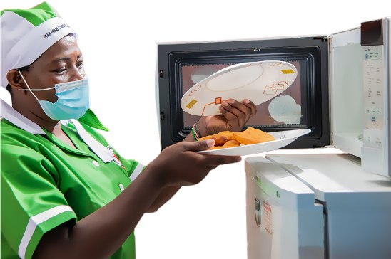 Star househelps worker using kitchen equipment during practical training